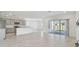 Spacious living area with sliding glass doors leading to the backyard at 1209 Kistna Dr, Zephyrhills, FL 33540