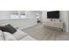 Bright loft area with plush carpet and a built-in media console at 1209 Kistna Dr, Zephyrhills, FL 33540
