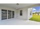 Covered patio with sliding glass doors at 1209 Kistna Dr, Zephyrhills, FL 33540