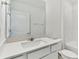 Clean bathroom with white cabinets and quartz countertop at 1185 Kistna Dr, Zephyrhills, FL 33540