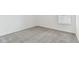 Simple bedroom with grey carpet and neutral color palette at 1185 Kistna Dr, Zephyrhills, FL 33540
