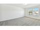 Spacious bedroom with neutral decor and natural light at 1185 Kistna Dr, Zephyrhills, FL 33540