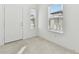 Light and airy entryway with tile flooring and ample natural light at 1185 Kistna Dr, Zephyrhills, FL 33540