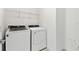 Laundry room with Whirlpool washer and dryer at 1185 Kistna Dr, Zephyrhills, FL 33540