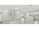 Open living room and kitchen with tile floor at 1185 Kistna Dr, Zephyrhills, FL 33540
