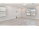 Spacious living room with tile floor and lots of natural light at 1185 Kistna Dr, Zephyrhills, FL 33540
