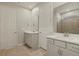 Elegant bathroom with double vanity and shower at 3782 Maxwell Park Dr, Sun City Center, FL 33573