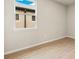 Bright bedroom with tile flooring and large window at 3782 Maxwell Park Dr, Sun City Center, FL 33573