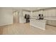 Open concept kitchen with island and stainless steel appliances at 3782 Maxwell Park Dr, Sun City Center, FL 33573