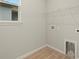 Laundry room with window, shelving, and hookups at 3782 Maxwell Park Dr, Sun City Center, FL 33573