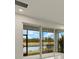 Screened patio with view of the lake and golf course at 3782 Maxwell Park Dr, Sun City Center, FL 33573