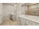 Modern bathroom with double vanity, quartz countertop and large shower at 11680 Myakka Blue Dr, Venice, FL 34293