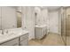 Elegant bathroom featuring double vanity and a walk-in shower at 11680 Myakka Blue Dr, Venice, FL 34293