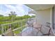 Peaceful balcony with glass-top table and chairs, offering scenic water views at 3226 Mangrove Point Dr, Ruskin, FL 33570