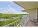 Scenic balcony view overlooking a tranquil waterway and lush greenery at 3226 Mangrove Point Dr, Ruskin, FL 33570