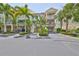 Two-story townhome with attached garage and tropical landscaping at 3226 Mangrove Point Dr, Ruskin, FL 33570