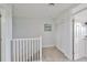 Upstairs hallway with linen closet and carpet flooring at 3226 Mangrove Point Dr, Ruskin, FL 33570