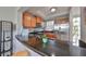 Modern kitchen with stainless steel appliances and dark granite countertops at 3226 Mangrove Point Dr, Ruskin, FL 33570