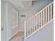 Staircase with white railing leading to upper level at 3226 Mangrove Point Dr, Ruskin, FL 33570