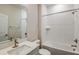 Modern bathroom with wave-patterned tile and a soaking tub at 10304 Surrey Rose Dr, San Antonio, FL 33576