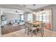 Casual dining area with wood table and chairs, open to the living room at 30805 Satinleaf Run, Brooksville, FL 34602