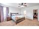 Large main bedroom with carpeted floor, walk-in closet, and ensuite bathroom at 30805 Satinleaf Run, Brooksville, FL 34602
