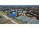 Aerial view of community amenities including tennis courts and pool at 11612 Mansfield Point Dr, Riverview, FL 33569