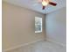 Bright bedroom with ceiling fan and window at 11612 Mansfield Point Dr, Riverview, FL 33569