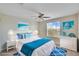 Virtually staged bedroom with coastal decor at 11612 Mansfield Point Dr, Riverview, FL 33569