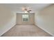 Bright and airy bedroom with carpeted floor and large window at 11612 Mansfield Point Dr, Riverview, FL 33569