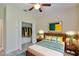 Bright bedroom with wood bed frame and large closet at 11612 Mansfield Point Dr, Riverview, FL 33569