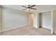 Bedroom with ceiling fan and closet at 11612 Mansfield Point Dr, Riverview, FL 33569