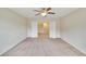 Spacious bedroom with carpet flooring and double doors leading to another room at 11612 Mansfield Point Dr, Riverview, FL 33569