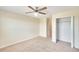 Bedroom with ceiling fan and closet at 11612 Mansfield Point Dr, Riverview, FL 33569