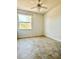 Bright bedroom with tile flooring and ceiling fan at 761 Tremont Greens Ln # 61, Sun City Center, FL 33573