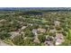 Neighborhood aerial view showing homes and a lake at 811 Woodcarver Ln, Brandon, FL 33510