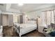 Main bedroom featuring ensuite bathroom access and neutral decor at 811 Woodcarver Ln, Brandon, FL 33510