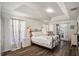 Main bedroom with a metal bed frame and plenty of natural light at 811 Woodcarver Ln, Brandon, FL 33510