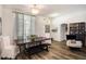 Bright dining room with a farmhouse table and hardwood floors at 811 Woodcarver Ln, Brandon, FL 33510