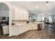 Modern kitchen with white cabinets, stainless steel appliances, and tile backsplash at 811 Woodcarver Ln, Brandon, FL 33510