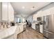 Modern kitchen with white cabinets, stainless steel appliances, and breakfast bar at 811 Woodcarver Ln, Brandon, FL 33510