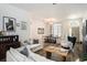 Bright and airy living room featuring hardwood floors and comfortable seating at 811 Woodcarver Ln, Brandon, FL 33510