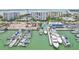 Aerial view of a waterfront community with marina and construction at 851 Bayway Blvd # 104, Clearwater Beach, FL 33767