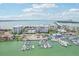 Aerial view of the community, marina, and bridge at 851 Bayway Blvd # 104, Clearwater Beach, FL 33767