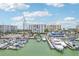 Aerial view showing waterfront property, marina, and construction at 851 Bayway Blvd # 104, Clearwater Beach, FL 33767