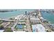 Aerial view of waterfront property, tennis courts and bridge at 851 Bayway Blvd # 104, Clearwater Beach, FL 33767