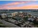 Aerial view of waterfront community with tennis courts and pool at 851 Bayway Blvd # 104, Clearwater Beach, FL 33767