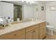 Spa-like bathroom with granite vanity and shower at 851 Bayway Blvd # 104, Clearwater Beach, FL 33767