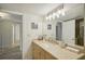 Modern bathroom with granite countertop and mirror at 851 Bayway Blvd # 104, Clearwater Beach, FL 33767