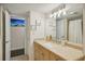 Bathroom with granite countertop and new light fixtures at 851 Bayway Blvd # 104, Clearwater Beach, FL 33767